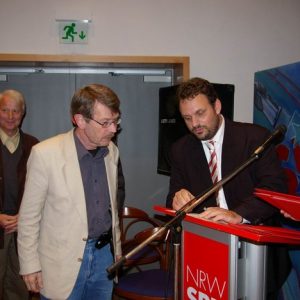 Guido van den Berg und Dr. Kai Faßbender ehren Mitglieder